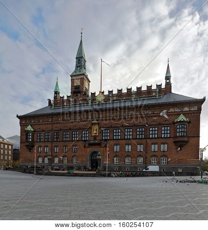 COPENHAGEN, DENMARK - NOVEMBER 7, 2016: People in front of the City Hall. The building was erected in 1905 by design of the architect Martin Nyrop