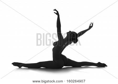 Nude yoga artistic photos of beautiful sexy body of young woman with perfect figure on splits isolated on white background studio shot