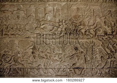 Wall image of people in ankor wat cambodia