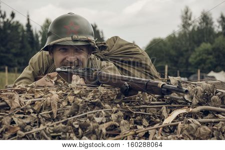 PERM RUSSIA - JULY 30 2016: Historical reenactment of World War II summer 1942. Soviet soldier with rifle