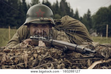 PERM RUSSIA - JULY 30 2016: Historical reenactment of World War II summer 1942. Soviet soldier with rifle