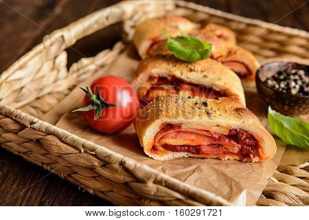 Stromboli Stuffed With Cheese, Salami, Green Onion And Tomato Sauce