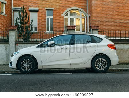 PARIS FRANCE - NOV 29 2016: BMW 2-series Active Tourer family van parked on a calm city. The 2-Series currently competes with new models from Audi and Mercedes-Benz the A3 Sedan and the CLA Class respectively until BMW releases its own front wheel drive/