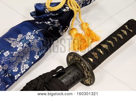Japanese sword in a sheath of a black stone pattern
