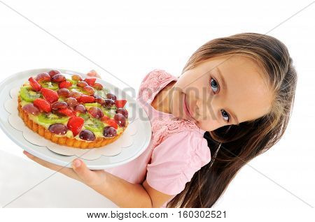 Little girl holding the plate with pie