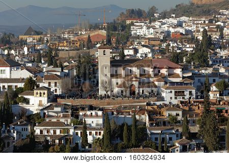 People at the Church of San Nicolas in Granada, Spain