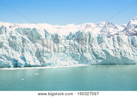 Frontal detailed view of Perito Moreno glaciar in argentinian Patagonia - World famous nature wonder of south american country of Argentina - Natural azure turquoise light blue color tones