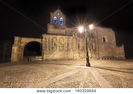 night scene of Church San Vicente Martir and San Sebastian in Frias Burgos province Spain.