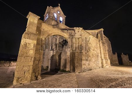 Starry night and Church of San Vicente Martir and San Sebastian in Frias Burgos province Spain.