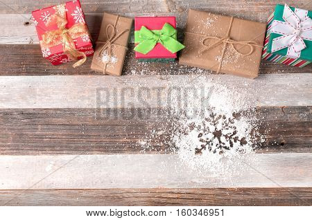Christmas gifts on wooden board. Winter holiday