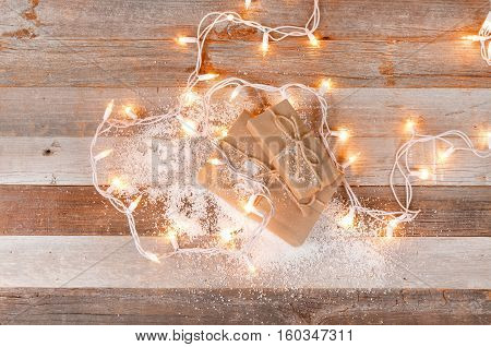 Christmas background with gift boxes and christmas ornaments on wooden board
