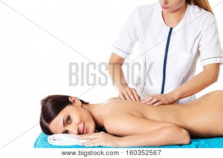 Woman having massage of body in the spa salon. Beauty treatment concept.