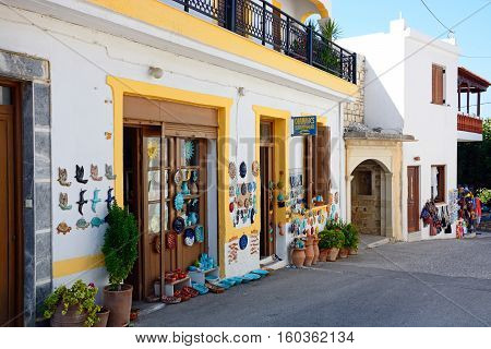 MARGARITES, CRETE - SEPTEMBER 15, 2016 - Pottery displayed on the wall of a shop in the village centre Margarites Crete Greece Europe, September 15, 2016.