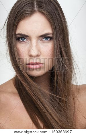 strong facial expression concept - young woman portrait with resentful negative grimace on her face