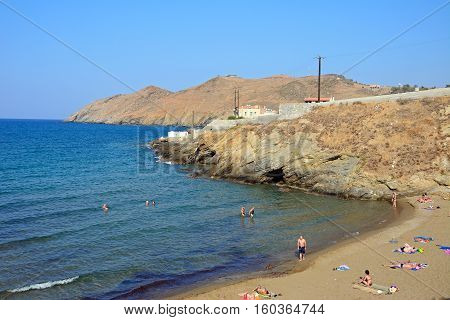 PANORMOS, CRETE - SEPTEMBER 15, 2016 - Tourists relaxing on the sandy beach Panormos Crete Greece Europe, September 15, 2016.