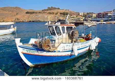 PANORMOS, CRETE - SEPTEMBER 15, 2016 - Traditional Greek fishing boat in the harbour Panormos Crete Greece Europe, September 15, 2016.