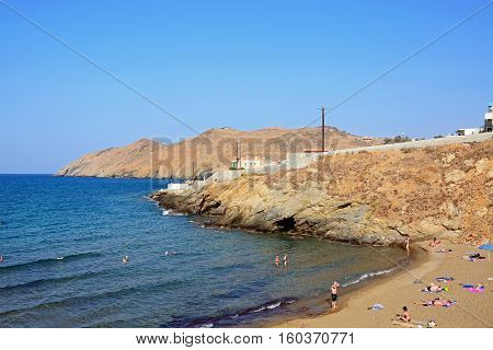PANORMOS, CRETE - SEPTEMBER 15, 2016 - Tourists relaxing on the sandy beach Panormos Crete Greece Europe, September 15, 2016.