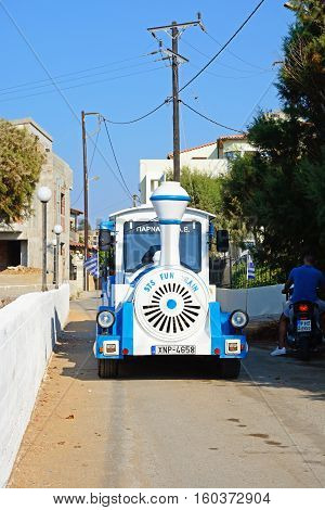 PANORMOS, CRETE - SEPTEMBER 15, 2016 - Front view the towns blue tourist land train Panormos Crete Greece Europe, September 15, 2016.