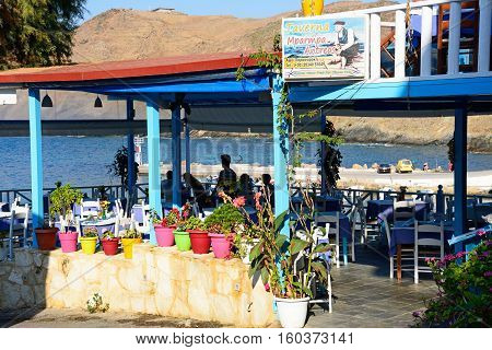 PANORMOS, CRETE - SEPTEMBER 15, 2016 - Traditional Greek taverna restaurant by the sea Panormos Crete Greece Europe, September 15, 2016.