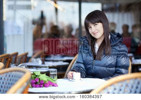 Smiling Brunette Lady In Parisian Street Cafe