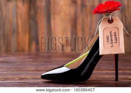 Women's day tag and shoe. Red flower and greeting label. Pamper your lady. Perfect present for stylish girl.