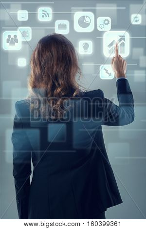 Modern futuristic technology, multiple hologram icons showing online connectivity, calendar, tracking apps, social media, email