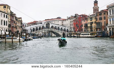 Raghetti Boat And Rialto Bridge In Venice In Rain