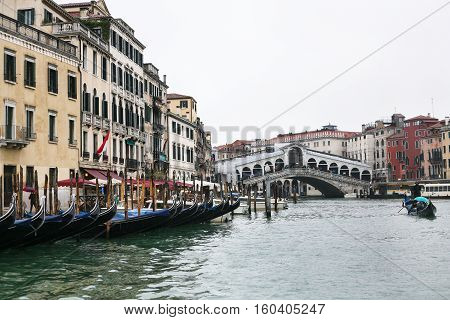 Gondolas In Grand Canal In Venice City In Rain