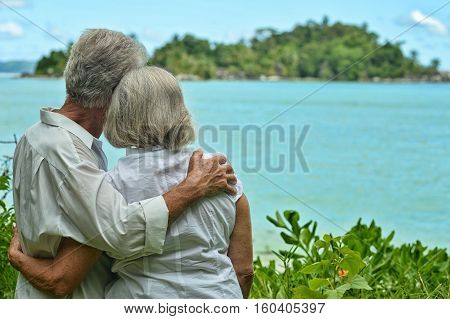 Happy elderly couple rest at tropical beac