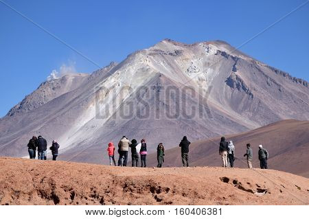 BOLIVIA - AUGUST 29: Unidentified people at Ollague or Ullawi stratovolcano in the Andes on the border between Bolivia and northern Chile on August 29 2016.