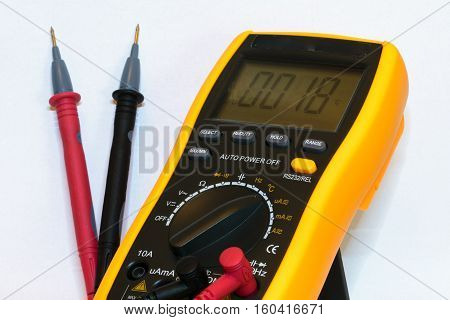 Digital multimeter with test leads connected - isolated on white background
