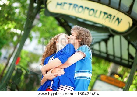 Young Romantic Couple Kissing Near Metro Station In Paris