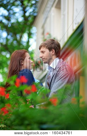 Man And Woman Together On Balconyof Their House Or Hotel