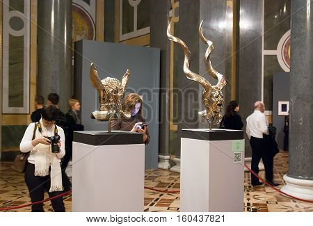 St Petersburg, Russia, Dec 1, 2016: People look at the self-portraits of artist. Exhibit of temporary modern art exhibition 