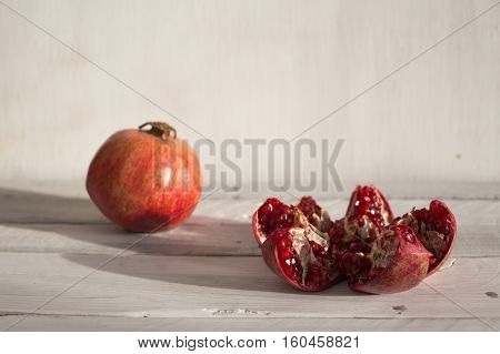 Pomegranate on a white background ripe pomegranate red pomegranate on a white background pomegranate seeds