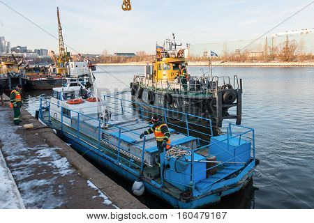 MOSCOW, RUSSIA - NOVEMBER 11, 2016: State Unitary Enterprise Mosvodostok performs recovery vessels on coastal winter parking. Ships Mosvodostok on the Moscow River.