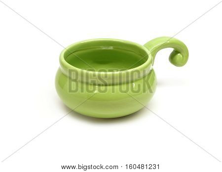Single small clay empty green cocotte isolated on white front view closeup