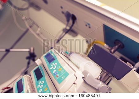 Syringe on the medical devices in ICU.