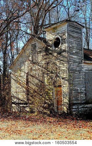 Pittsboro North Carolina - December 7 2016: Delapidated ruins of an abandonned wooden church on Route 15-501 near Bynum
