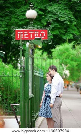 Beautiful Couple Is Hugging Near The Metro Station In Paris