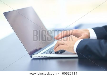 Person Typing on a modern laptop