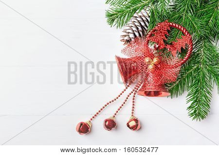 Christmas New Year composition with tangerines, cones, nuts, wicker basket and fir branches in rustic style on old wooden background, selective focus, Background new year, fir, gift, cones, orange, blue ball, red background, snow, ,