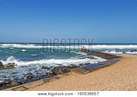 Curved Concrete Pier At Rocky Umkomaas Beach