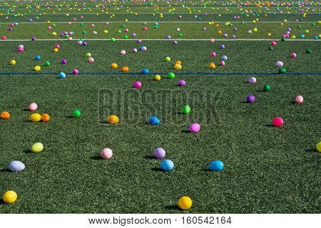 Easter egg hunt with plastic colored eggs