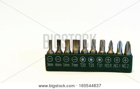 Kit of 10 screw bits isolated with green case