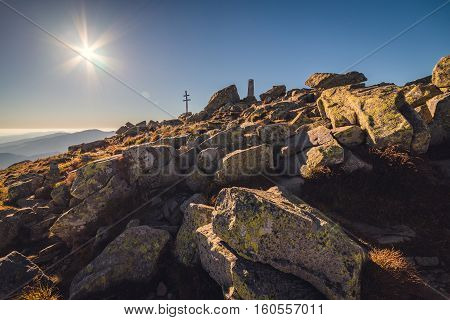 Sun over Mountain Peak with Double Cross. Mount Dumbier Low Tatras Slovakia