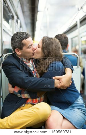 Couple Kissing In The Parisian Metro
