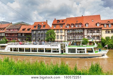 BAMBERG, GERMANY - JUNE 2, 2016:  Sightseeing boat trip on Regnitz river in Bamberg, Upper Franconia, Germany