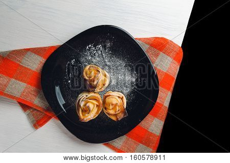 Delicious And Beautiful Apple Rose Puff Pastries Lies On Table