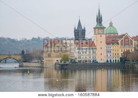 Panorama of an old Prague, bridges and embankment of Vitava river, Czechia